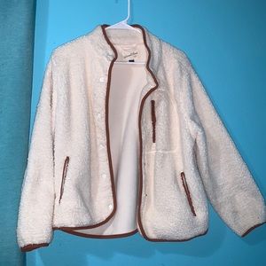 Fluffy white jacket with orange trimming